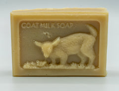hand crafted goat milk soap bar with baby goat and butterflies design on top, fragranced in Australian sandalwood